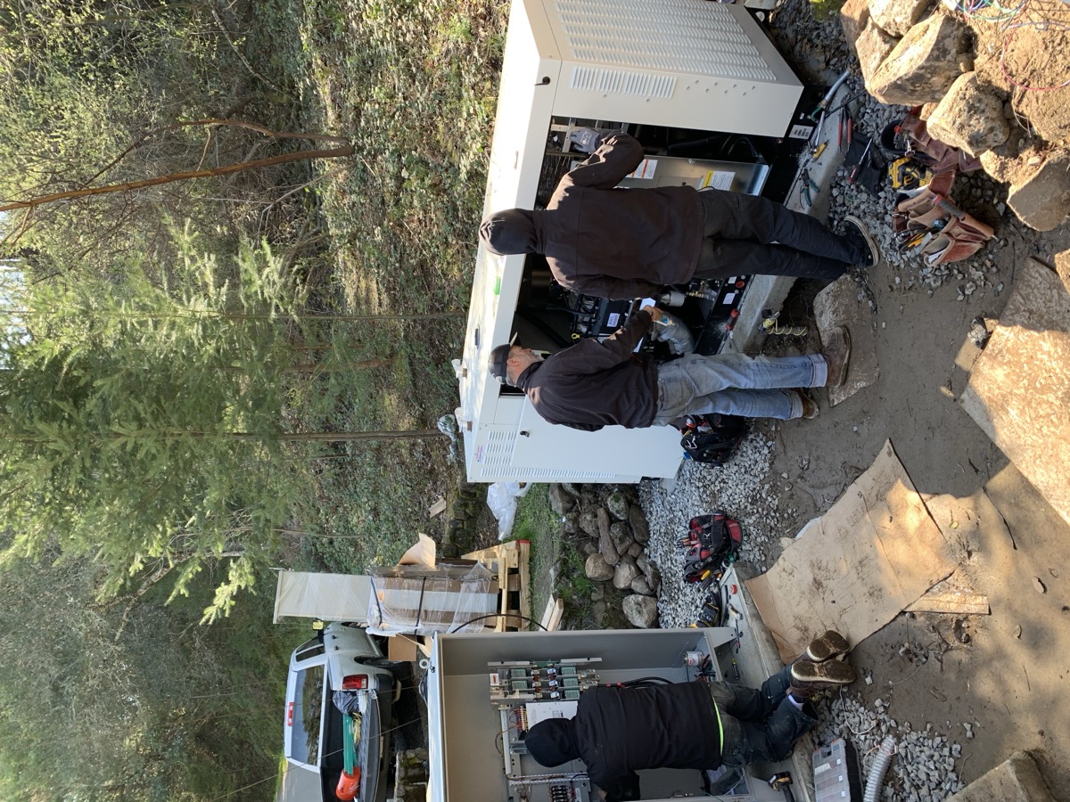 Eleos Electric crew installing a standby generator